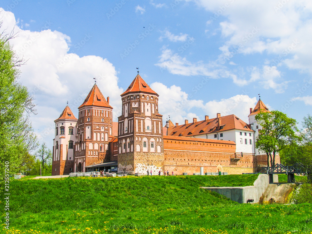 Mir, Belarus. Castle Complex Mir On Sunny Day with blue sky Background. Old medieval Towers and walls of traditional fort from unesco world heritage list