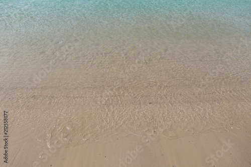 Soft waves on sandy beach