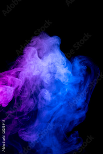 Red and blue smoke isolated on black background.