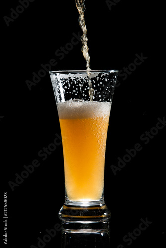 craft beer glass on black background