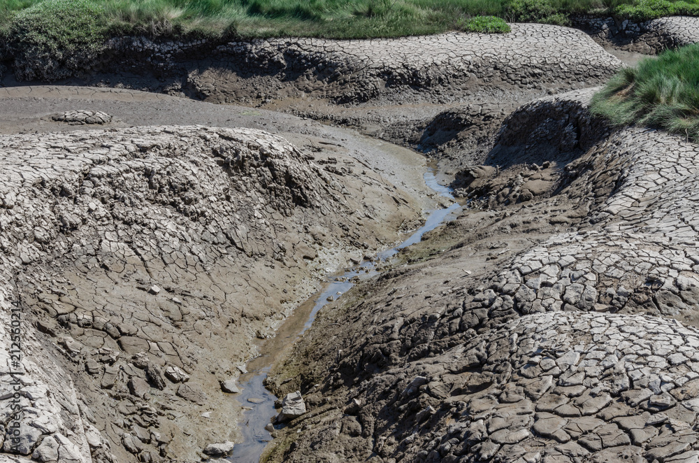 Dried and cracked mud banks. Dried and cracked mud banks.