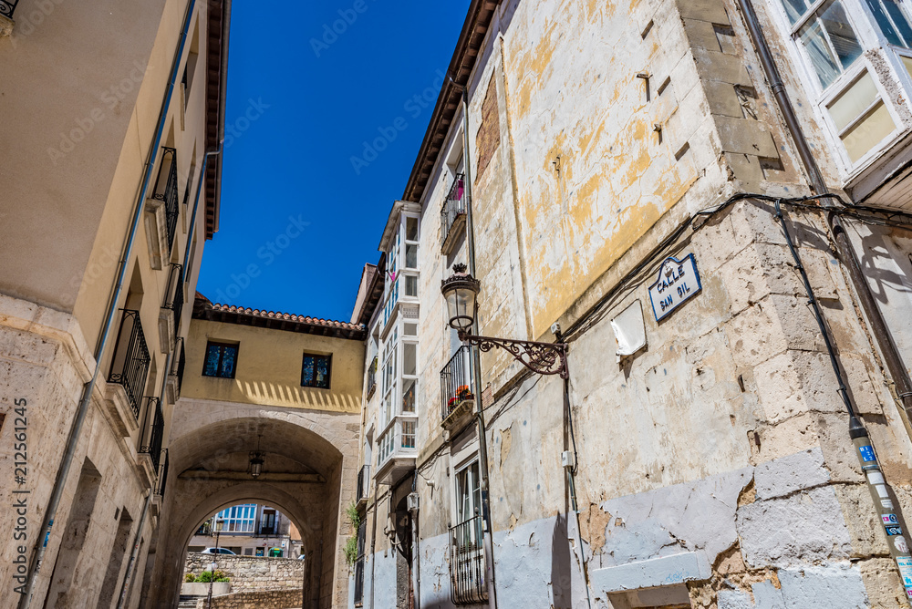 Street view of the Calle San Gil with the Arco de San Gil in Burgos, Spain