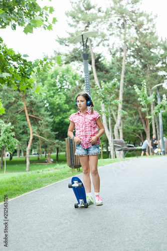 Girl skating in the park and having fun