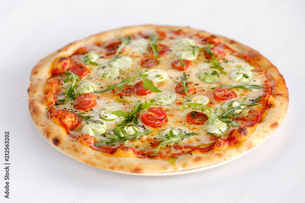 Pizza with tomatoes and arugula and mozzarella