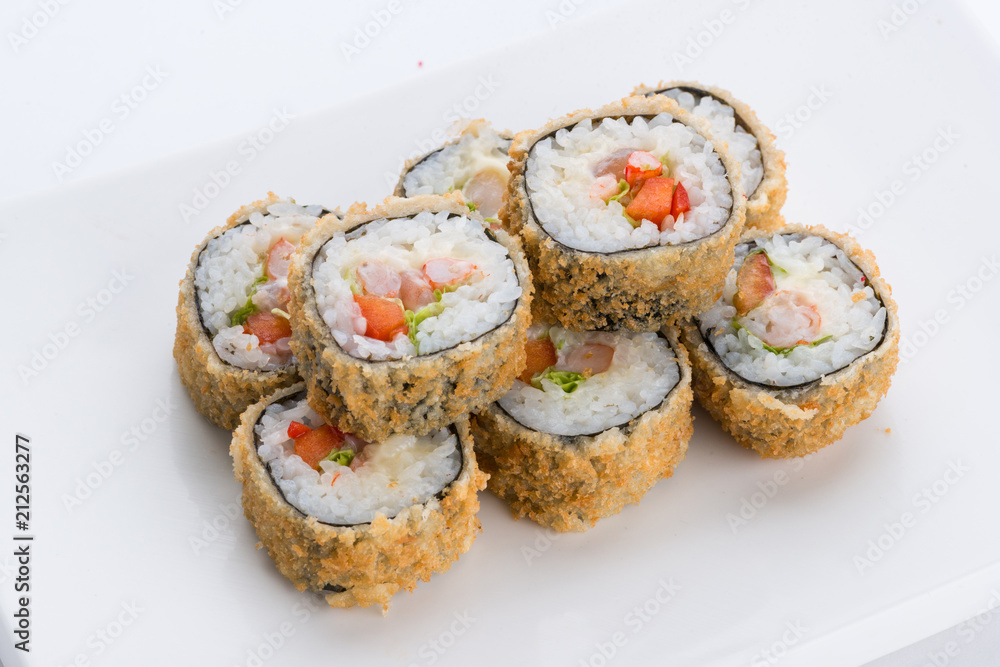 Sushi set and composition at white background. Japanese food restaurant, sushi maki gunkan roll plate or platter set. Sushi set and composition at white background. Japanese food restaurant, sushi maki gunkan roll plate or platter set.