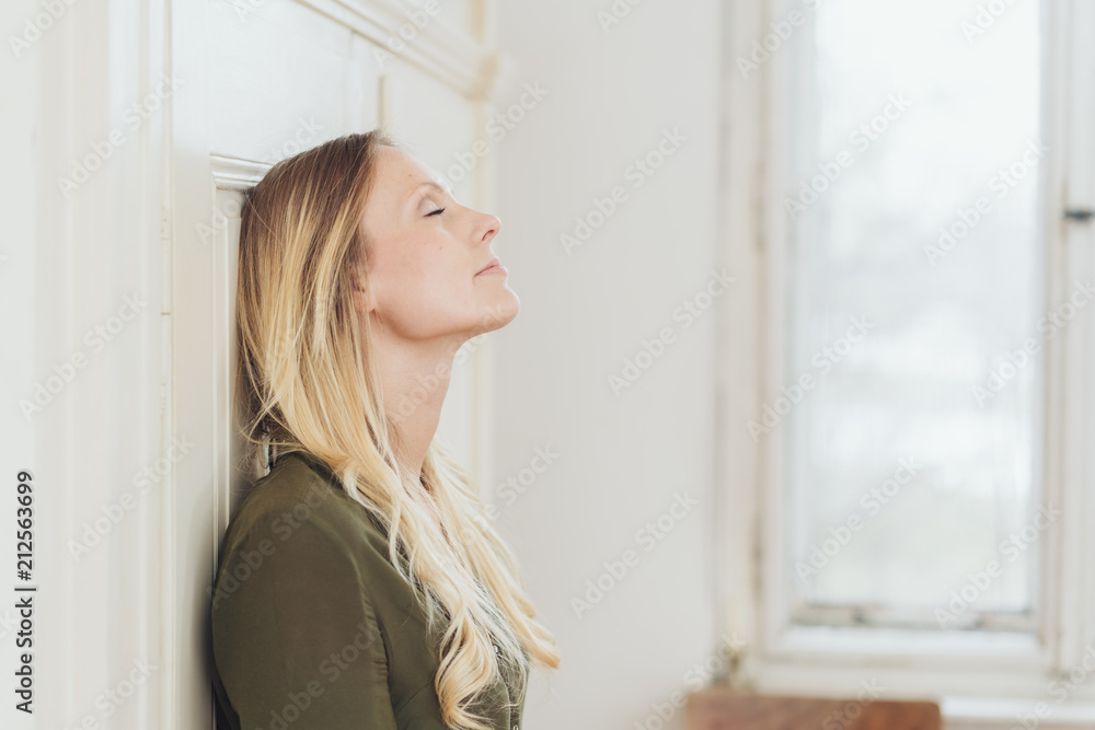 Young blond woman taking a moment to relax Young blond woman taking a moment to relax