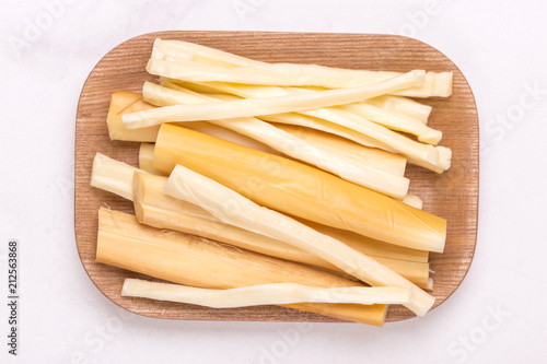 Healthy Snack. Smoked string cheese. Kobarcik. Selective focus photo