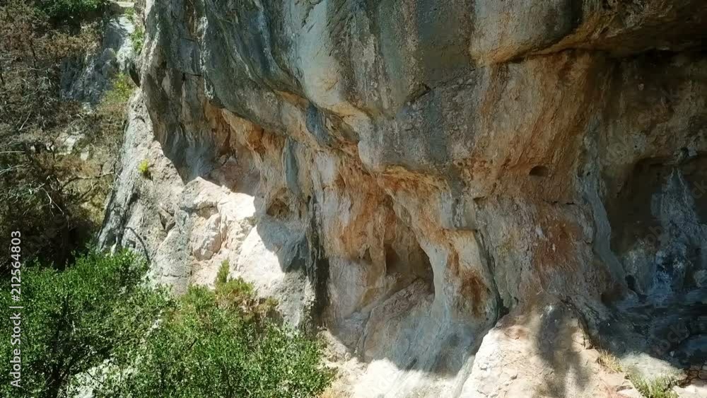 Aerial: Flying in front of natural climbing wall at island Ugljan in Croatia. Filmed on sea vacation in Mediterranean Adriatic sea. Aerial: Flying in front of natural climbing wall at island Ugljan in Croatia. Filmed on sea vacation in Mediterranean Adriatic sea.