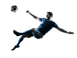 one caucasian soccer player man playing kicking in silhouette isolated on white background