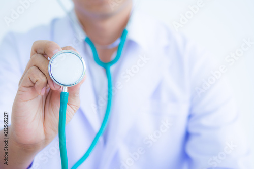 Doctor in white coat with stethoscope on white background for health care concept