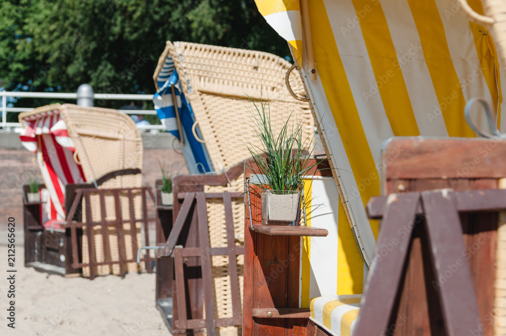 Φωτογραφία Beach chairs on the beach at the sea to rest and relax on vacation in sand