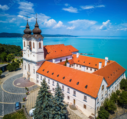 Tihany, Hungary - Aerial view of the famous Benedictine Monastery of Tihany (Tihany Abbey, Tihanyi Apatsag) with beautiful coloruful Lake Balaton and blue sky at background