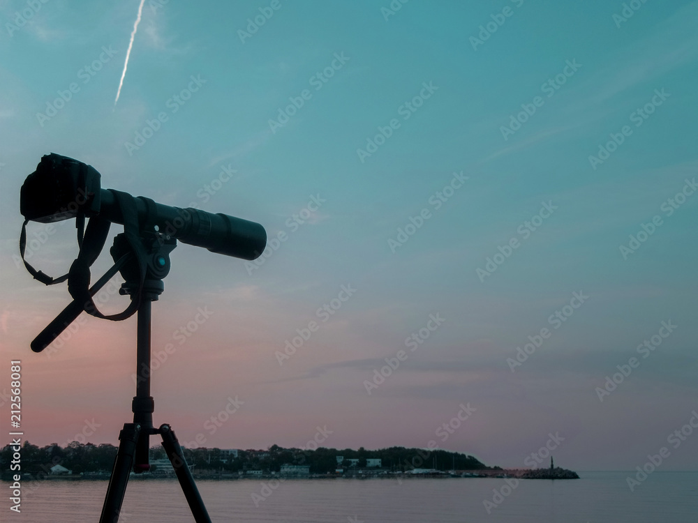 Tripod camera against the sunset lights in the Bay of Tsarevo, Black ...