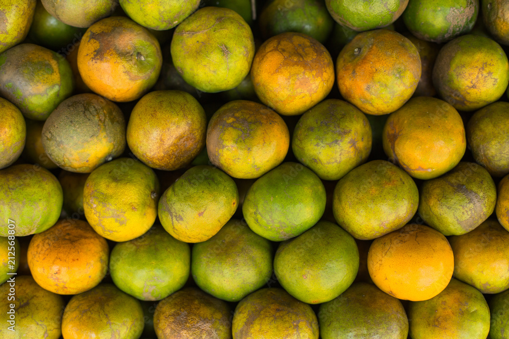 Tangerine, Thai orange ,Asian orange, Thai fruit, Thai traditional fruit.Fresh Oranges background,sweet green Thai orange for sale. Tangerine, Thai orange ,Asian orange, Thai fruit, Thai traditional fruit.Fresh Oranges background,sweet green Thai orange for sale.