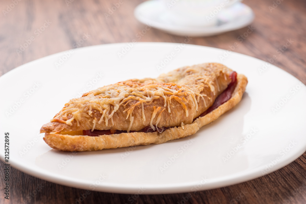 croissant ham cheese on white plate croissant ham cheese on white plate
