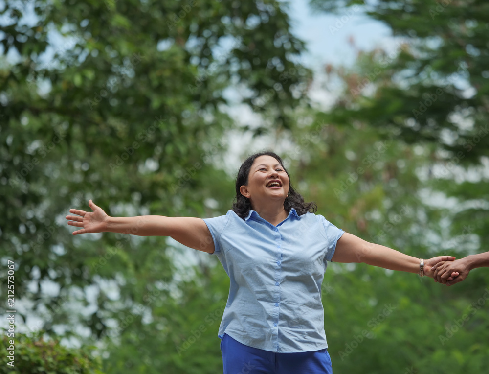 Close up Senior woman walking in summer park,travel concept. Close up Senior woman walking in summer park,travel concept.