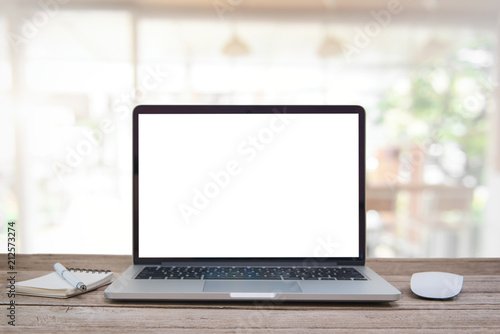 Computer notebook and mouse with a coffee shop