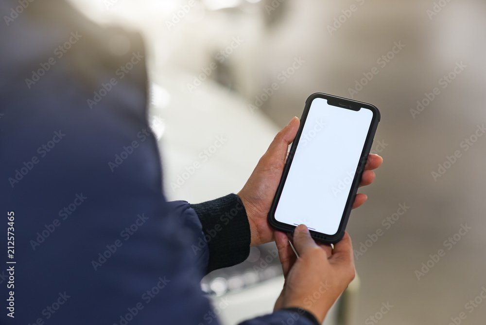 Hand is holding showing smartphone Hand is holding showing smartphone