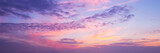 Panoramic view of a pink and purple sky at sunset. Sky panorama background.