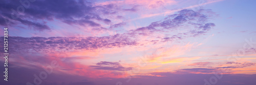 Panoramic view of a pink and purple sky at sunset. Sky panorama background.