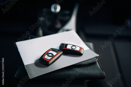Keys and documents inside car interior