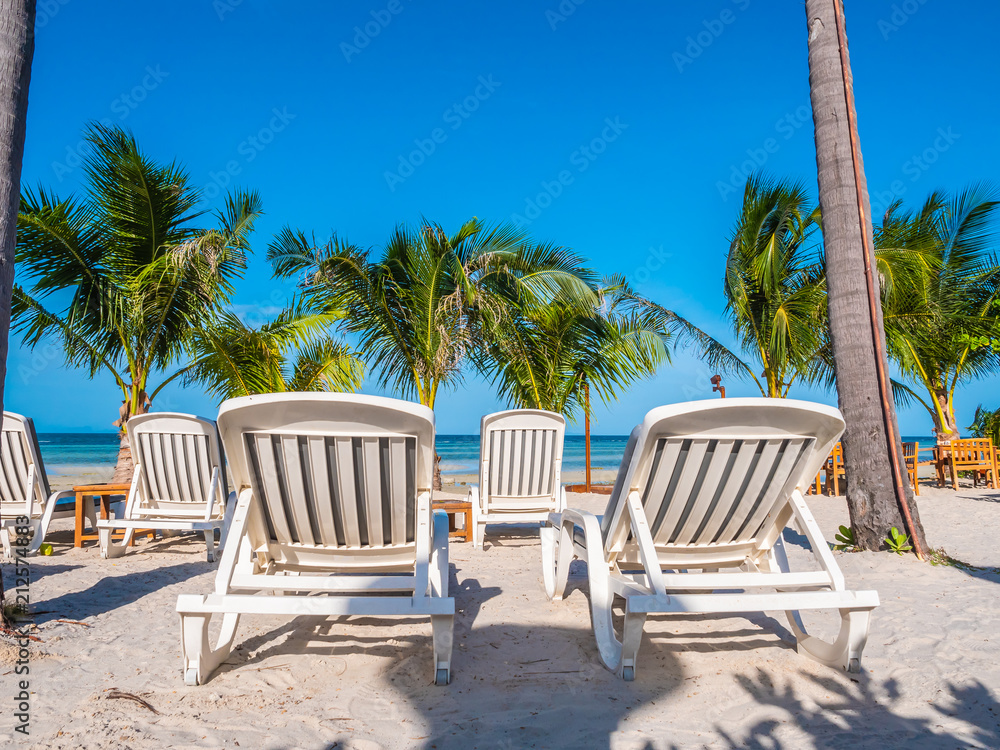 Umbrella and chair on the beach and sea ocean with blue sky