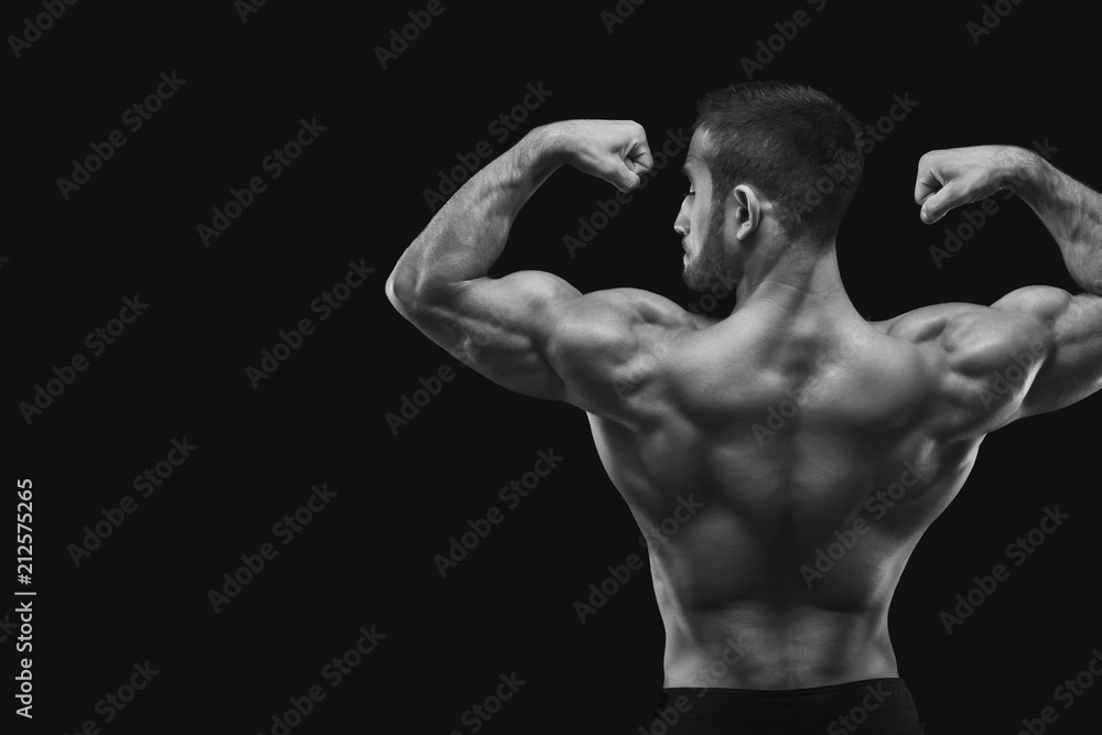 Unrecognizable man shows strong back muscles closeup