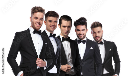 Fotografie portrait of five attractive men wearing tuxedoes standing in line