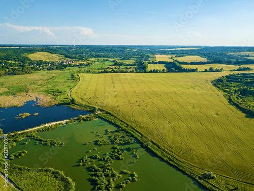 Aerial view over of a rural landscape near a lake © Oleg
