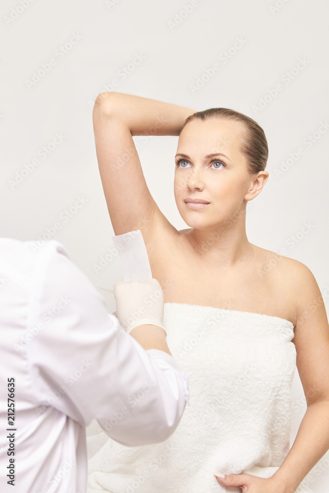 Salon hair removal epilation with girl. Female depilation. No pain tool waxing, or sugaring Salon hair removal epilation with girl. Female depilation. No pain tool waxing, or sugaring