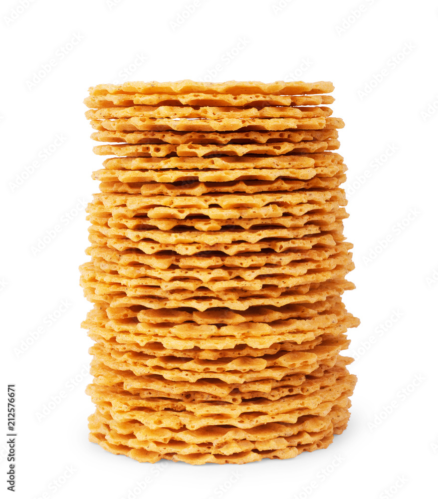 A stack of thin, crispy, round wafers on a white background