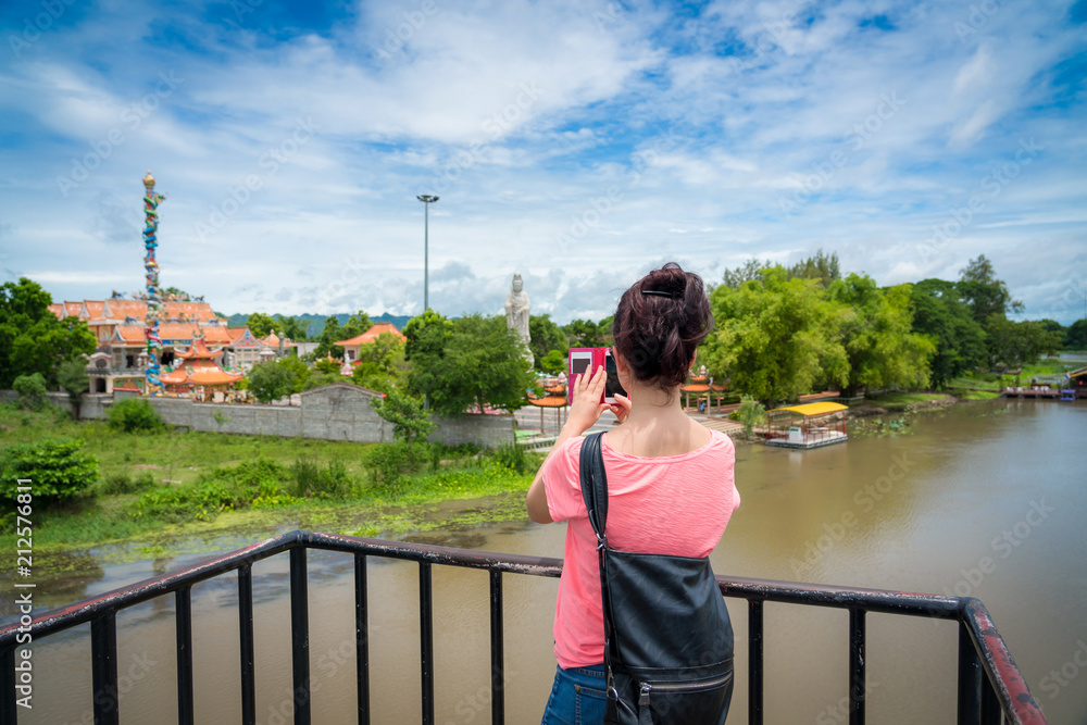 Fototapeta premium Woman traveler traveling walking with backpack at the jungle on holiday at weekend on background nature view