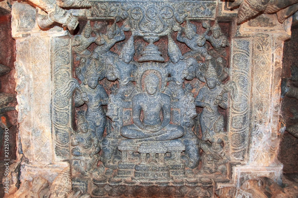 Carved figure of Jain tirthankara with his consorts at the ceiling of large common open hall called the mahamantapa or navaranga, Panchakuta Basadi, Kambadahalli, Mandya district, Karnataka
