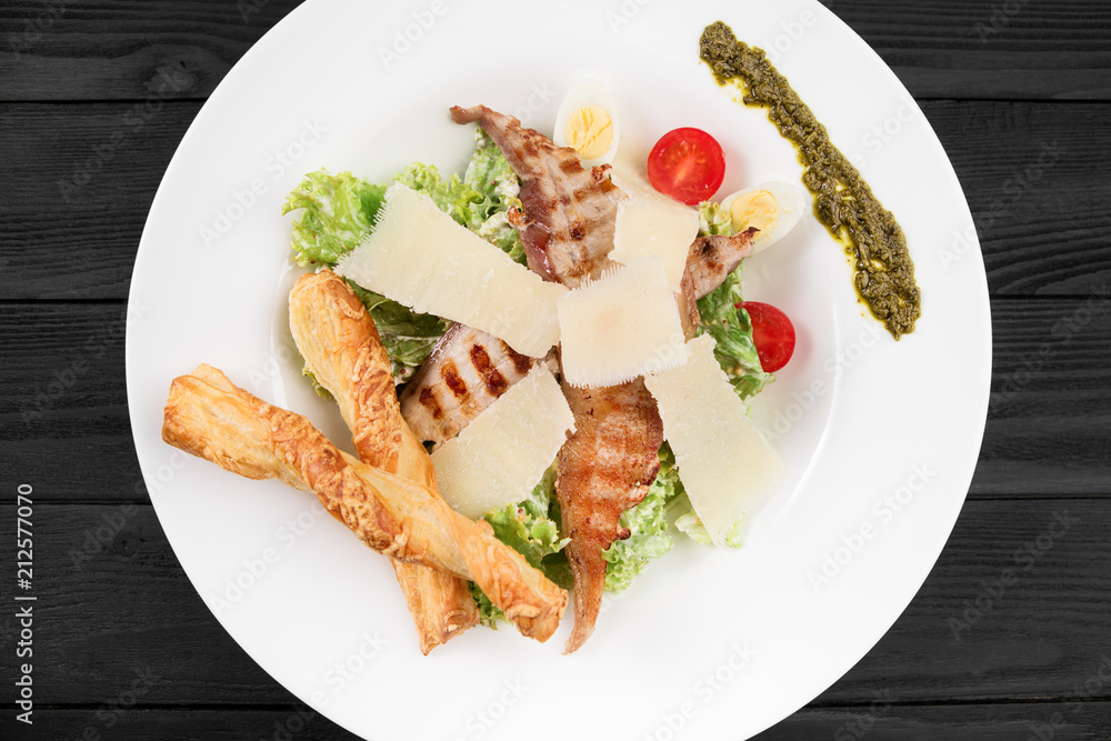 Healthy grilled chicken caesar salad with cheese and eggs. Healthy grilled chicken caesar salad with cheese and eggs.