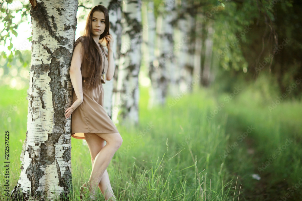 Summer sunny park portrait of a beautiful young woman Summer sunny park portrait of a beautiful young woman