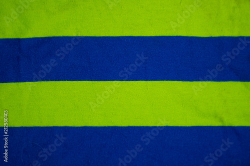Background of fabric in a light green and blue stripes.