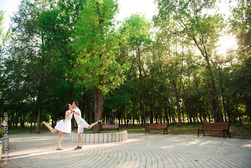 A beautiful couple is resting outside the city. Love story