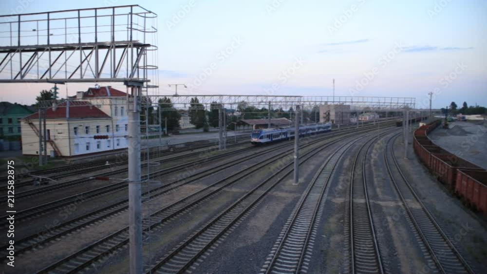 Modern passenger electric train, passing station