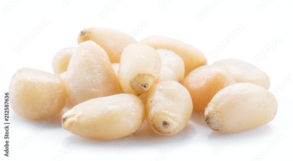 Pine nuts on the white background. Organic food. Pine nuts on the white background. Organic food.