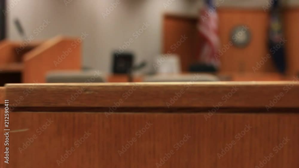 A wooden half door swings in a courtroom. A wooden half door swings in a courtroom.
