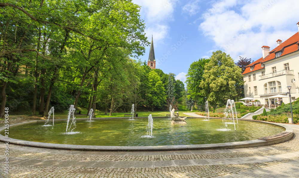 Olsztyn, northern Poland. Fountain in City Park on Lyna River Olsztyn, northern Poland. Fountain in City Park on Lyna River