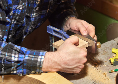 The process of making a classical guitar. Preparing to install the neckblock. photo