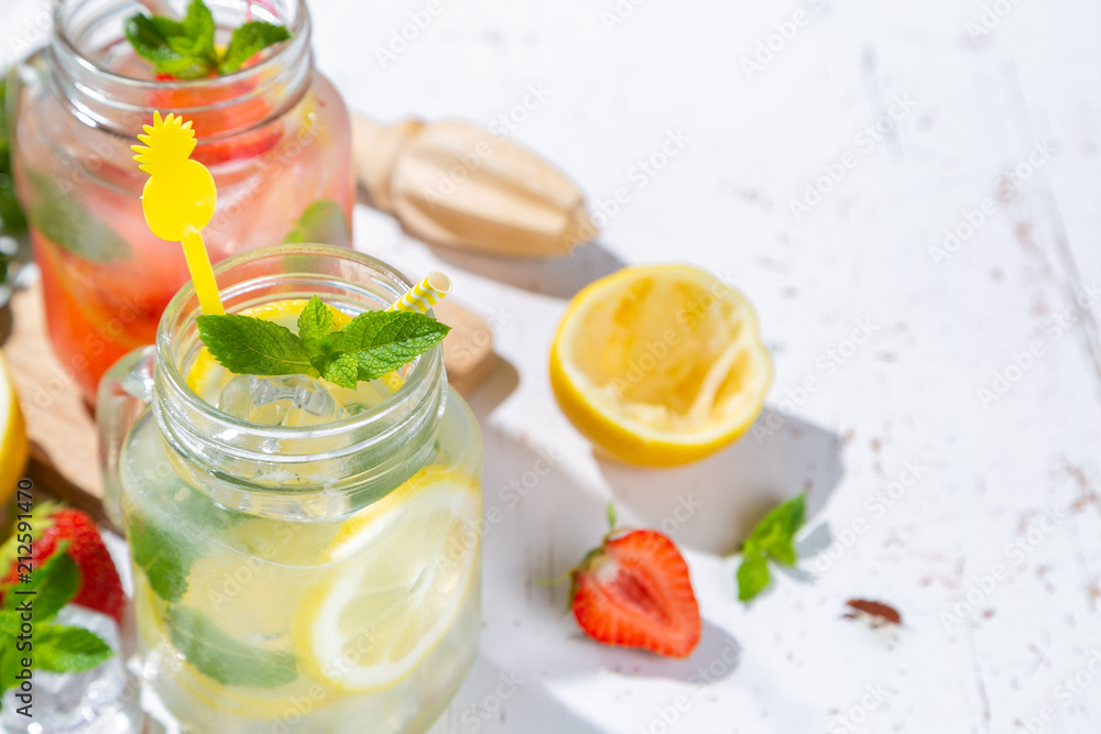 Selection of summer lemonades in glass jars Selection of summer lemonades in glass jars