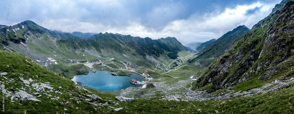 panoramic mountain view on lake Balea and on the Transfagarash - obrazy, fototapety, plakaty 