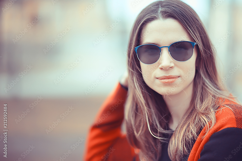 spring adult girl outdoor / March in Scotland, a girl in a plaid poses in the park spring adult girl outdoor / March in Scotland, a girl in a plaid poses in the park