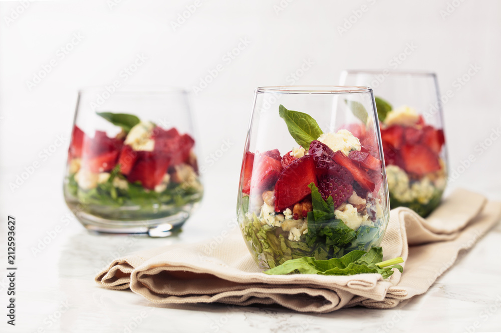 Spinach salad in glass.