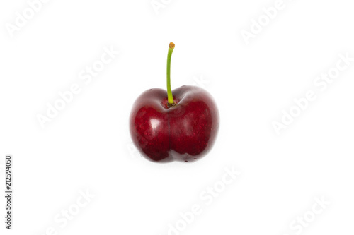 One whole sweet bright red cherry with a stem flatlay isolated on white...........................................................................