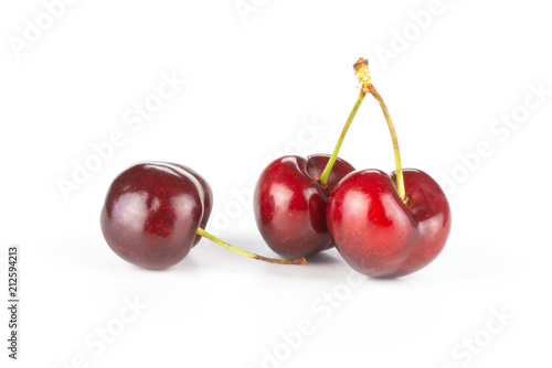 Group of three whole sweet bright red cherry set isolated on white...........................................................................