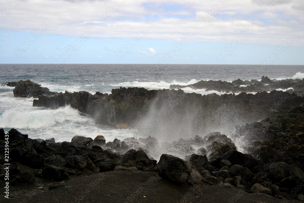 Reunion island seascape, landscape. Black sand, volcanic rocks.