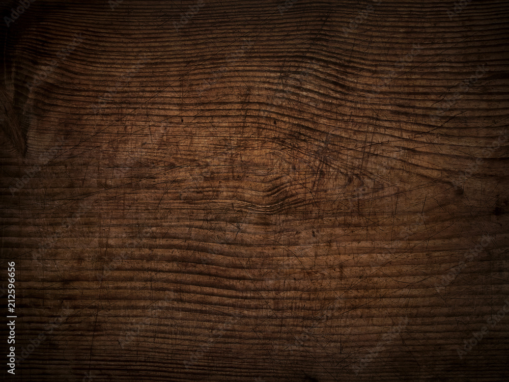 Fototapeta premium old scratched dark wooden board background